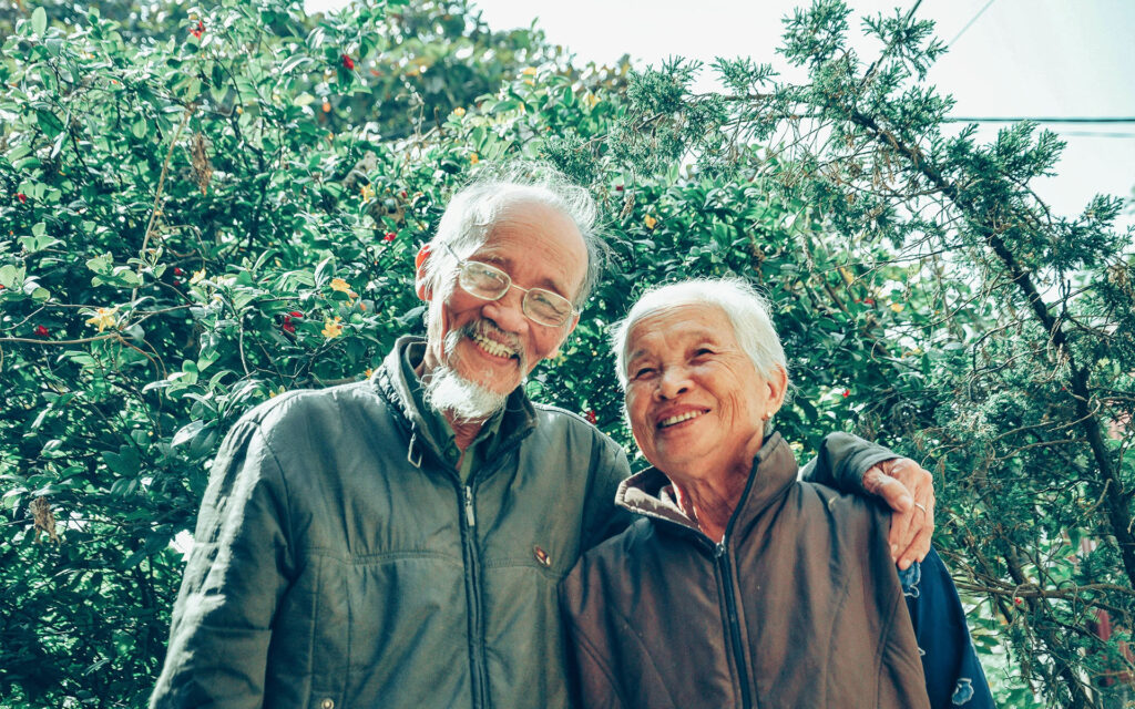 Elderly woman and man in a garden